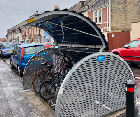 Metal bike locker, with bikes locked inside