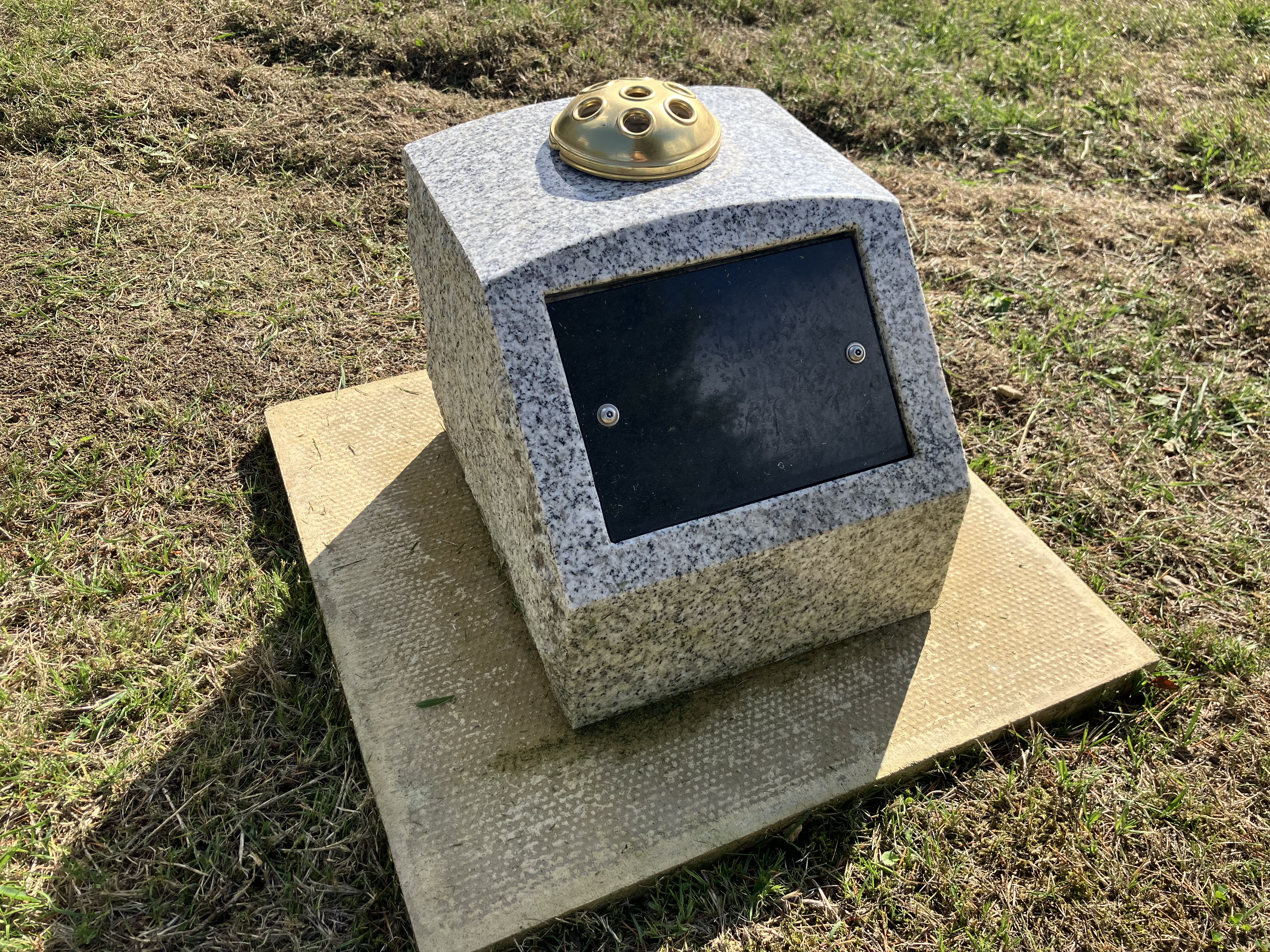 Open a large version of this image A boulder with a plaque on it sat upon a plinth