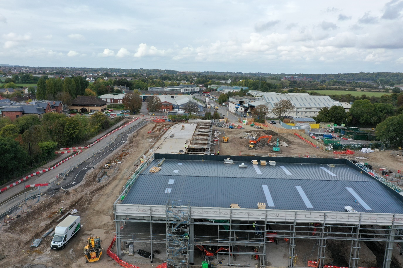 Shows the staff offices, welfare, training and education facilities and the fleet workshop in the foreground